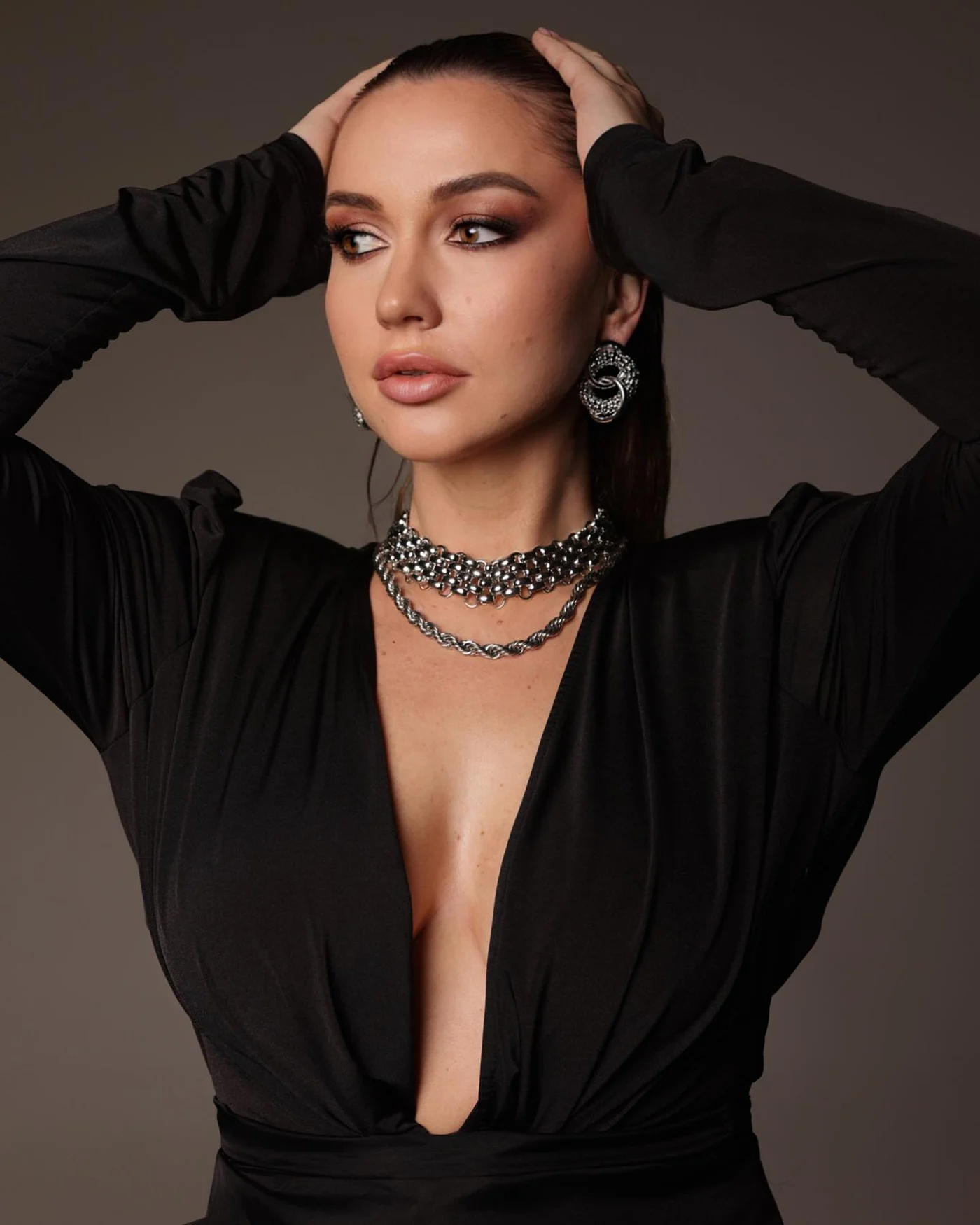 Lisa Smith wearing a black evening dress and silver jewelry